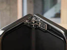 Conceptual close-up of a modern folding device hinge and titanium frame.