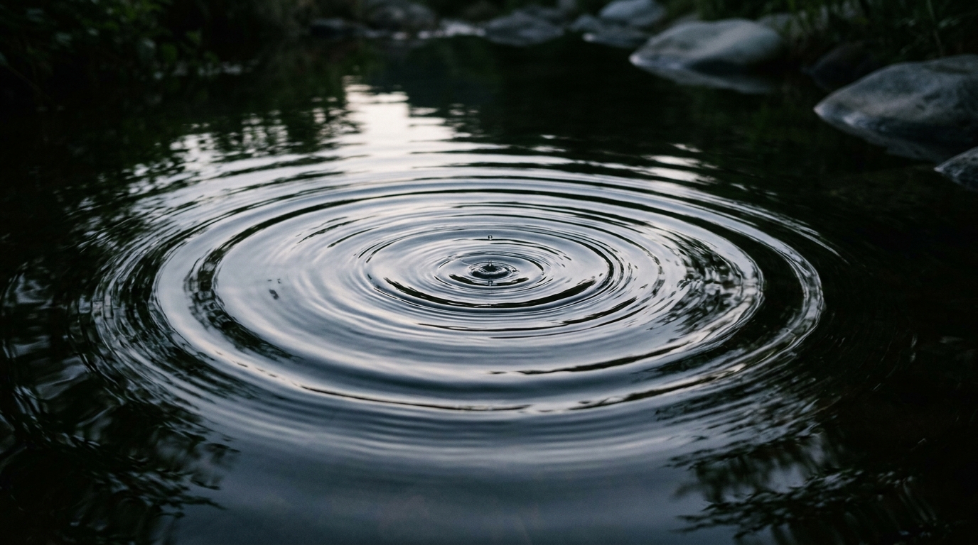 Abstract water ripples in a dark pool.