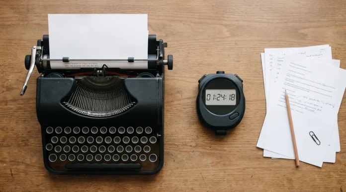 procedural-television-evolution A conceptual image of a writer's desk with a stopwatch and typewriter.