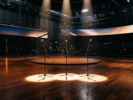 Conceptual image of three spotlights on a ballroom floor representing the new Strictly hosts