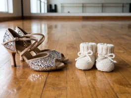 Conceptual image of dance shoes and baby booties on a studio floor