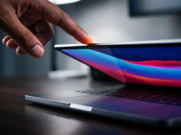 A conceptual close-up of a touch interface on a professional laptop display.
