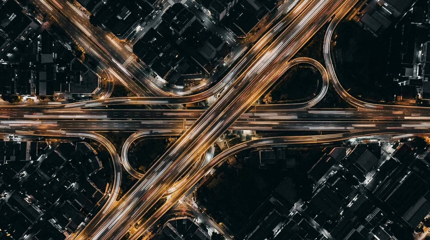 Abstract light trails on a city road representing urban mobility.