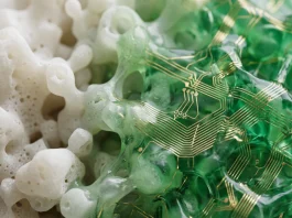 A conceptual depiction of synthetic textures changing from white to green and gold.